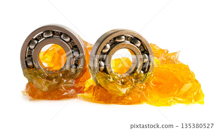 Ball bearing stainless with grease lithium machinery lubrication for automotive and industrial isolated on white background. Ball bearing stainless with grease lithium machinery lubrication for automotive and industrial isolated on white background. 135380527