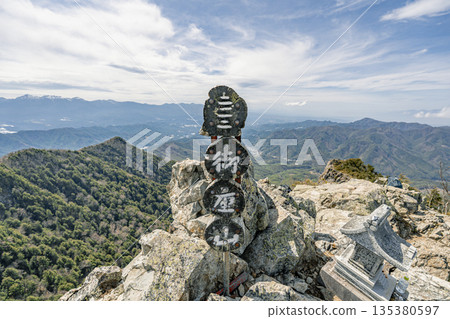 Mount Mitake summit sign and panoramic view | Blue sky ridgeline scenery 135380597