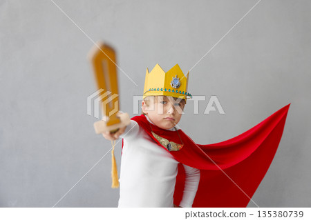 Child pretend to be knight. Kid having fun at home Child pretend to be knight. Kid having fun at home 135380739