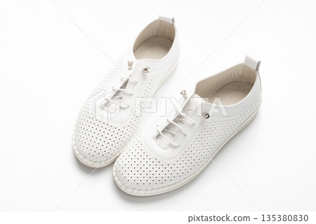 White sneakers on a white background White sneakers on a white background 135380830