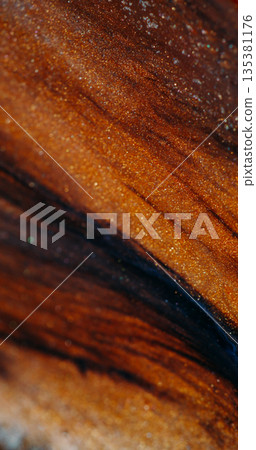 Sparkling texture defocused. Ink spread. Black volcanic ash stream on orange brown color lava leak. Shiny particles blend abstract background. Sparkling texture defocused. Ink spread. Black volcanic ash stream on orange brown color lava leak. Shiny particles blend abstract background. 135381176