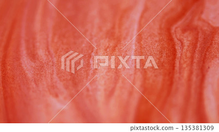 Drip mix. Ink stream. Defocused orange color chemical paint enamel water wet marble texture flow floating on abstract creative background. 135381309
