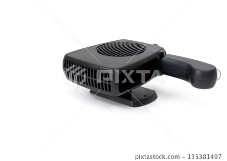 Compact black car heater powered by cigarette lighter, isolated on white background, portable automotive defrost device. 135381497