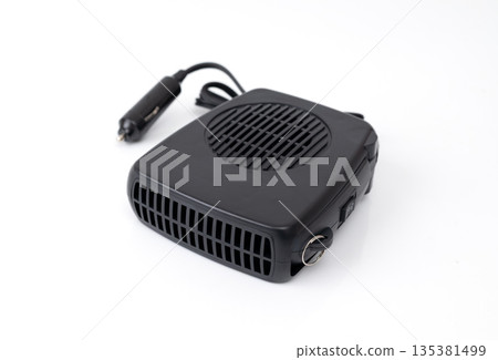 Compact black car heater powered by cigarette lighter, isolated on white background, portable automotive defrost device. 135381499