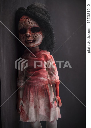 Creepy bloody doll face with long black hair in the dark 135381940
