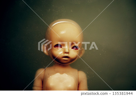 Creepy doll face in dark dirty water Creepy doll face in dark dirty water 135381944