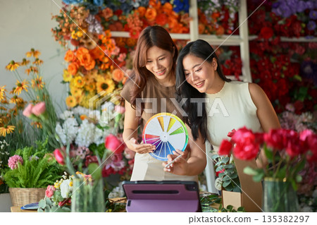 Florist teacher teaching online flower arrangement class with color wheel Florist teacher teaching online flower arrangement class with color wheel 135382297