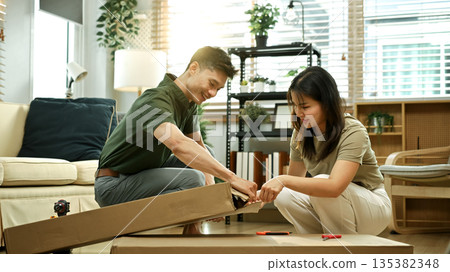 Photo series of young asian couple assembly a new furniture at home 135382348
