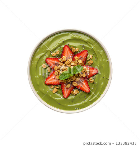 Vibrant green smoothie bowl topped with fresh strawberries, granola, and seeds, isolated. Perfect healthy breakfast or fitness meal 135382435
