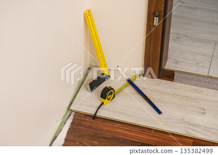 Renovations tools, tape measure, industrial ruler Renovations tools, tape measure, industrial ruler 135382499