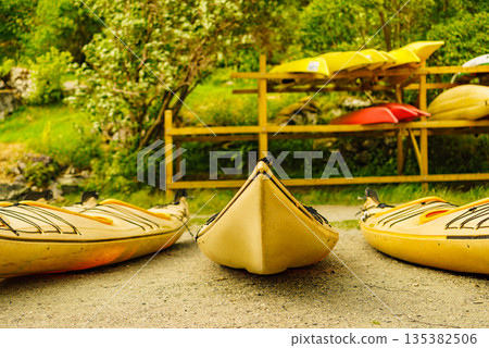 Kayaks on water shore. Rental area Kayaks on water shore. Rental area 135382506