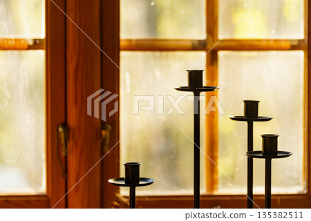 Window and vintage candlestick on sill Window and vintage candlestick on sill 135382511
