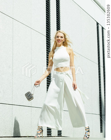 Playful woman wearing crop top and culottes 135382609