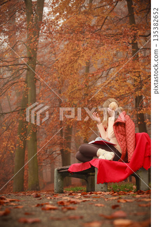 Young lady with literature. 135382652