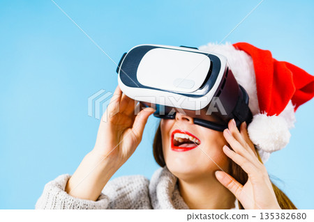 Girl watching 3d film tour in virtual reality glasses. Girl watching 3d film tour in virtual reality glasses. 135382680
