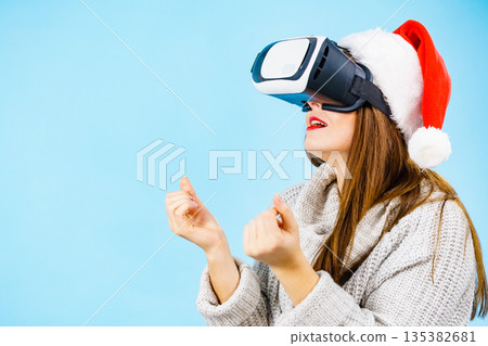 Girl watching 3d film tour in virtual reality glasses. Girl watching 3d film tour in virtual reality glasses. 135382681