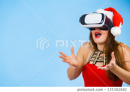 Girl watching 3d film tour in virtual reality glasses. Girl watching 3d film tour in virtual reality glasses. 135382682