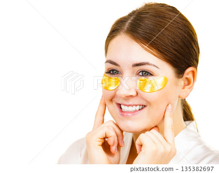 Woman with gold patches under eyes 135382697