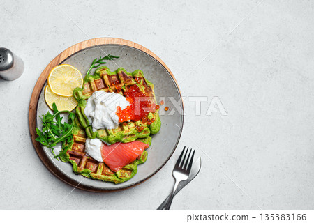 Healthy low carb breakfast plate with green spinach vegetable waffles, salmon, red caviar, soft cheese Healthy low carb breakfast plate with green spinach vegetable waffles, salmon, red caviar, soft cheese 135383166