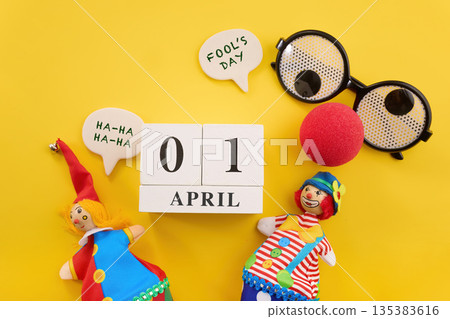 April fool's day celebrating humor with jester puppets and calendar April fool's day celebrating humor with jester puppets and calendar 135383616