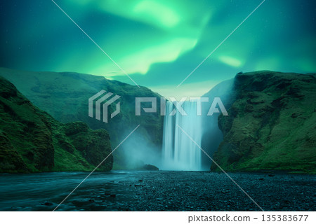 Aurora Borealis over famous Skogafoss waterfall on Skoga river Aurora Borealis over famous Skogafoss waterfall on Skoga river 135383677