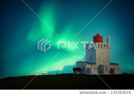 Aurora Borealis over white lighthouse at Cape Dyrholaey Aurora Borealis over white lighthouse at Cape Dyrholaey 135383678