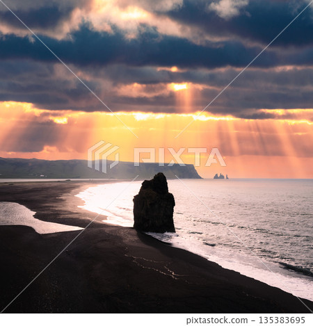 Reynisdrangar basalt sea stack in Vik 135383695