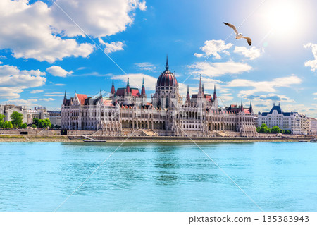Scenic view of the Parliament of Hungary and Danube River under cloudy sky, Budapest Scenic view of the Parliament of Hungary and Danube River under cloudy sky, Budapest 135383943