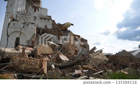 View to destroyed church at Kharkivska oblast. Ruined building after bomb attacks on ukrainian territory from russia army. Consequences of russian invasion of Ukraine. Slow motion View to destroyed church at Kharkivska oblast. Ruined building after bomb attacks on ukrainian territory from russia army. Consequences of russian invasion of Ukraine. Slow motion 135384118