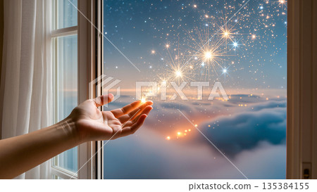A cinematic and dreamy shot showing a person's hand extended from an open window. A sparkling path of bright, magical stars flows from the fingertips toward the horizon, where soft clouds rest under a A cinematic and dreamy shot showing a person's hand extended from an open window. A sparkling path of bright, magical stars flows from the fingertips toward the horizon, where soft clouds rest under a 135384155