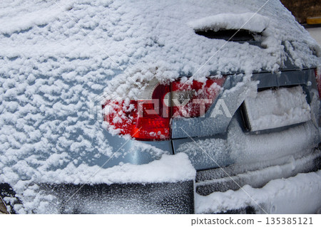 Four-wheel drive car covered with snow and ice Four-wheel drive car covered with snow and ice 135385121