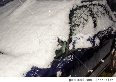 Four-wheel drive car covered with snow and ice Four-wheel drive car covered with snow and ice 135385136
