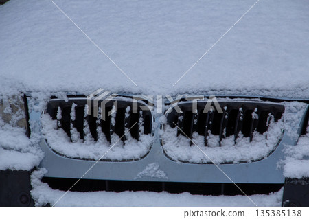 Four-wheel drive car covered with snow and ice Four-wheel drive car covered with snow and ice 135385138