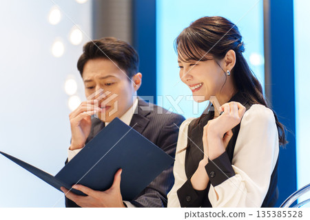 A man anxious about a restaurant menu 135385528