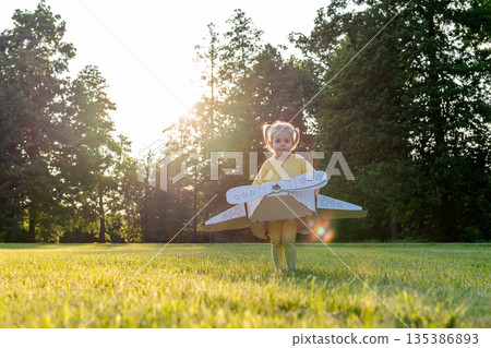 Pilot adventure. Girl flying airplane child. Cardboard costume imagination park. Pilot adventure. Girl flying airplane child. Cardboard costume imagination park. 135386893