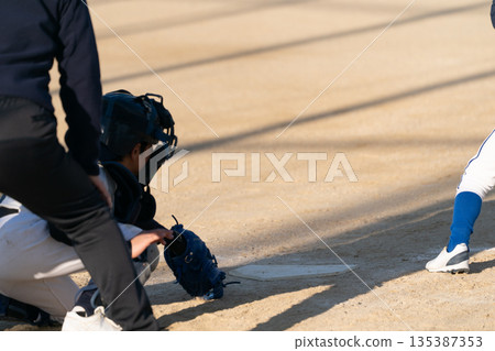 A young baseball player who is working hard to become a professional baseball player A young baseball player who is working hard to become a professional baseball player 135387353