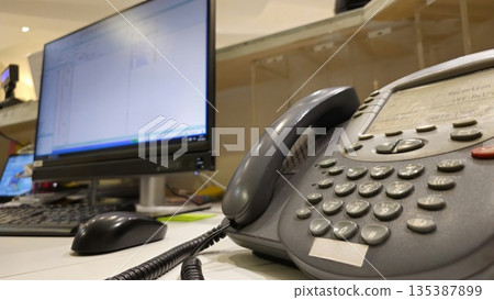 Office Desk with Telephone and Computer Monitor Office Desk with Telephone and Computer Monitor 135387899