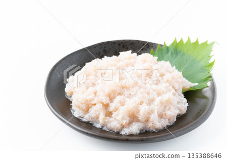 Boiled snow crab (flaked meat) served on a plate on a white background Boiled snow crab (flaked meat) served on a plate on a white background 135388646