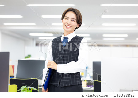 Portrait of a woman in a business uniform Portrait of a woman in a business uniform 135388882