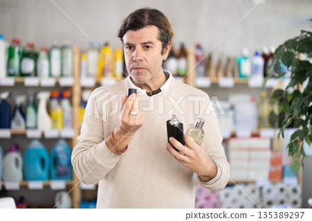 customer chooses perfume in the store customer chooses perfume in the store 135389297