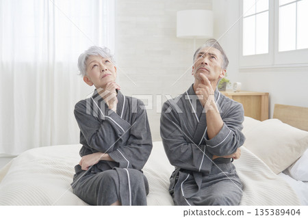 Senior couple thinking in the bedroom 135389404