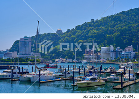 View towards Atami Castle from the yacht harbor on the sky deck of Atami Port in Atami City, Shizuoka Prefecture 135390043