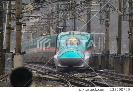 Tohoku Shinkansen bottleneck...E5 series Shinkansen passing through the at-grade intersection at Fukushima Station Tohoku Shinkansen bottleneck...E5 series Shinkansen passing through the at-grade intersection at Fukushima Station 135390769