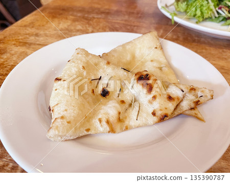 Italian focaccia: A simple flatbread made with olive oil and salt. Italian focaccia: A simple flatbread made with olive oil and salt. 135390787