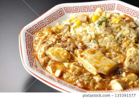 Mapo tofu fried rice photographed against a black background Mapo tofu fried rice photographed against a black background 135391577