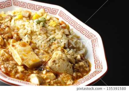 Mapo tofu fried rice photographed against a black background Mapo tofu fried rice photographed against a black background 135391580