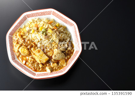 Mapo tofu fried rice photographed against a black background Mapo tofu fried rice photographed against a black background 135391590