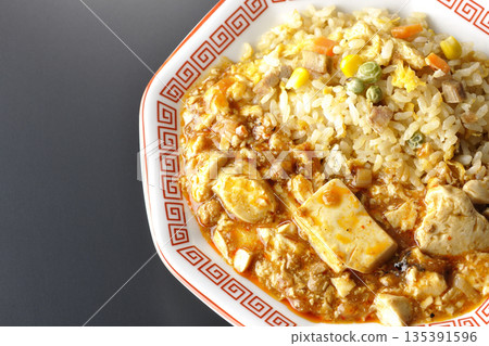 Mapo tofu fried rice photographed against a black background Mapo tofu fried rice photographed against a black background 135391596