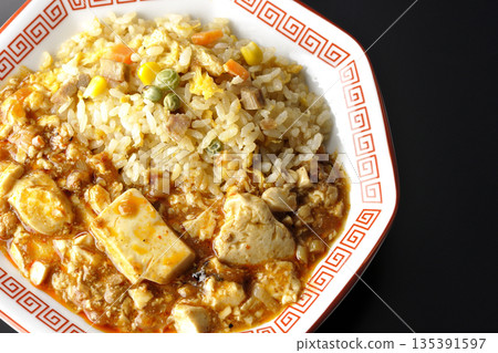 Mapo tofu fried rice photographed against a black background Mapo tofu fried rice photographed against a black background 135391597