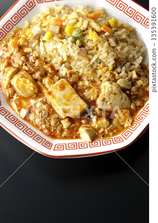 Mapo tofu fried rice photographed against a black background Mapo tofu fried rice photographed against a black background 135391600